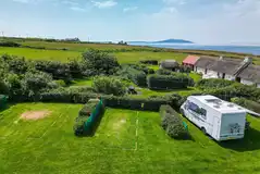 Electric grass pitches with hedges between