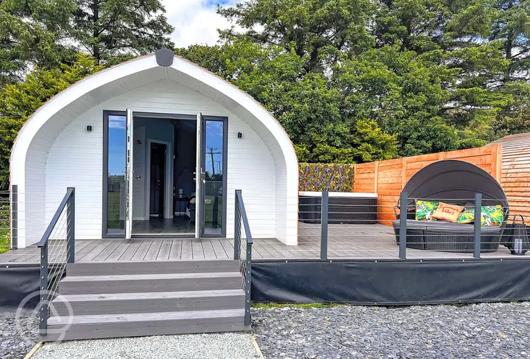 Glamping pod with a deck area and electric hot tub