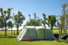 Large tent on an electric grass pitch at Vale of Pickering Caravan Park
