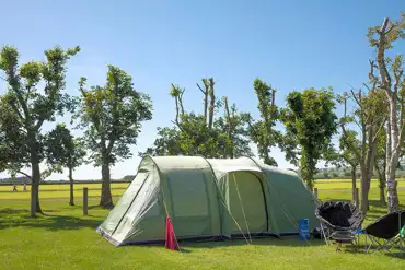 Large tent on an electric grass pitch at Vale of Pickering Caravan Park