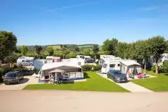 Electric hardstanding pitches (6m x 8m) for caravans, campervans, and motorhomes Electric hardstanding pitches (6m x 8m) for caravans, campervans, and motorhomes