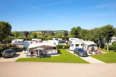 Electric hardstanding pitches (6m x 8m) for caravans, campervans, and motorhomes