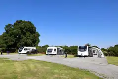 Hardstanding grass touring pitches measuring 8m by 10m