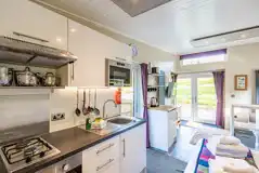 Merlin's Cabin kitchen with a hob, kettle, sink, fridge and microwave Merlin's Cabin kitchen with a hob, kettle, sink, fridge and microwave