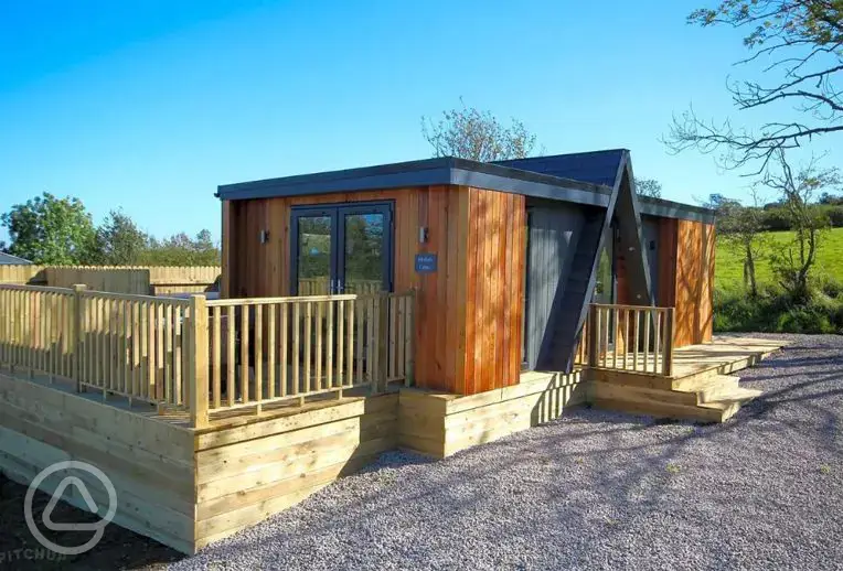 Merlin's Cabin with a private decking, hot tub and outdoor furniture