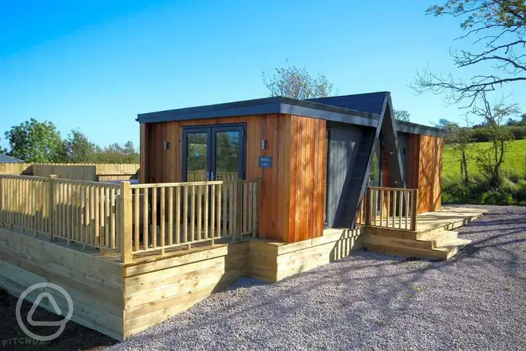 Merlin's Cabin with a private decking, hot tub and outdoor furniture