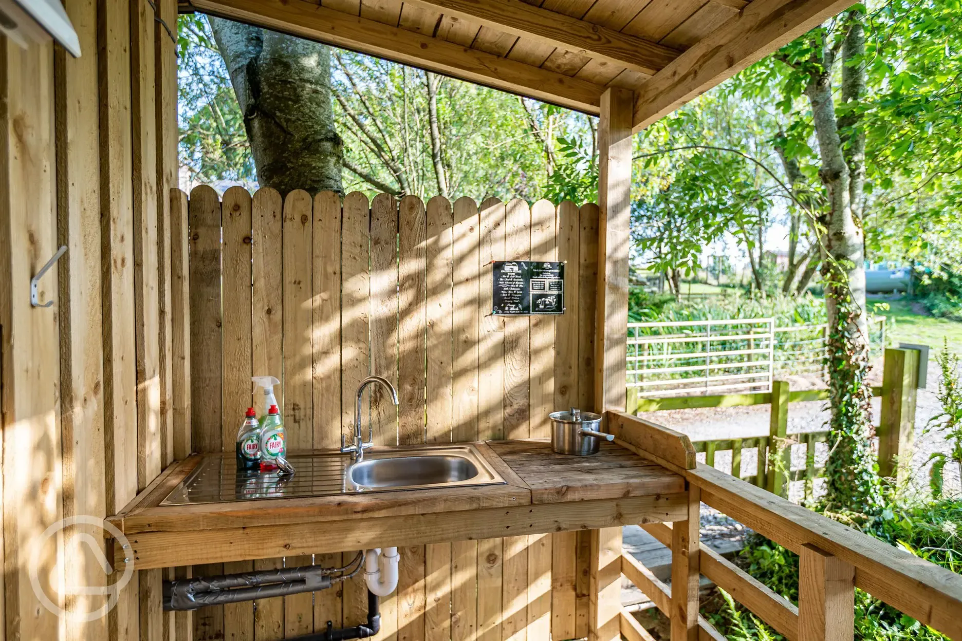 Outdoor, sheltered washing up area
