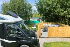 Fully serviced pitches with hot tubs and gated decking areas Fully serviced pitches with hot tubs and gated decking areas