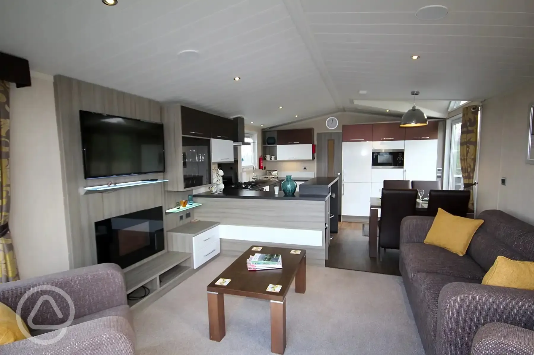 Skylark lodge interior with a living area, dining table and kitchen