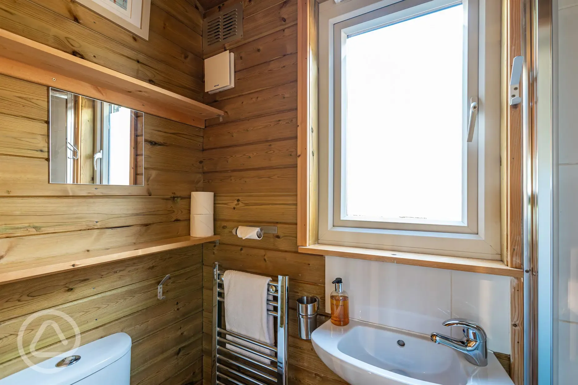 Treehouse Cabin ensuite with toilet, hand basin, shower and heated towel rail