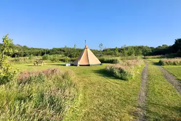 Non electric grass pitch in the meadow