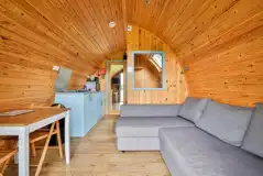 Ensuite glamping pod lounge and dining area with a kitchenette Ensuite glamping pod lounge and dining area with a kitchenette