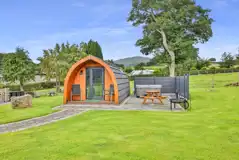 Ensuite glamping pod exterior with outdoor seating, fire pit and hot tub Ensuite glamping pod exterior with outdoor seating, fire pit and hot tub