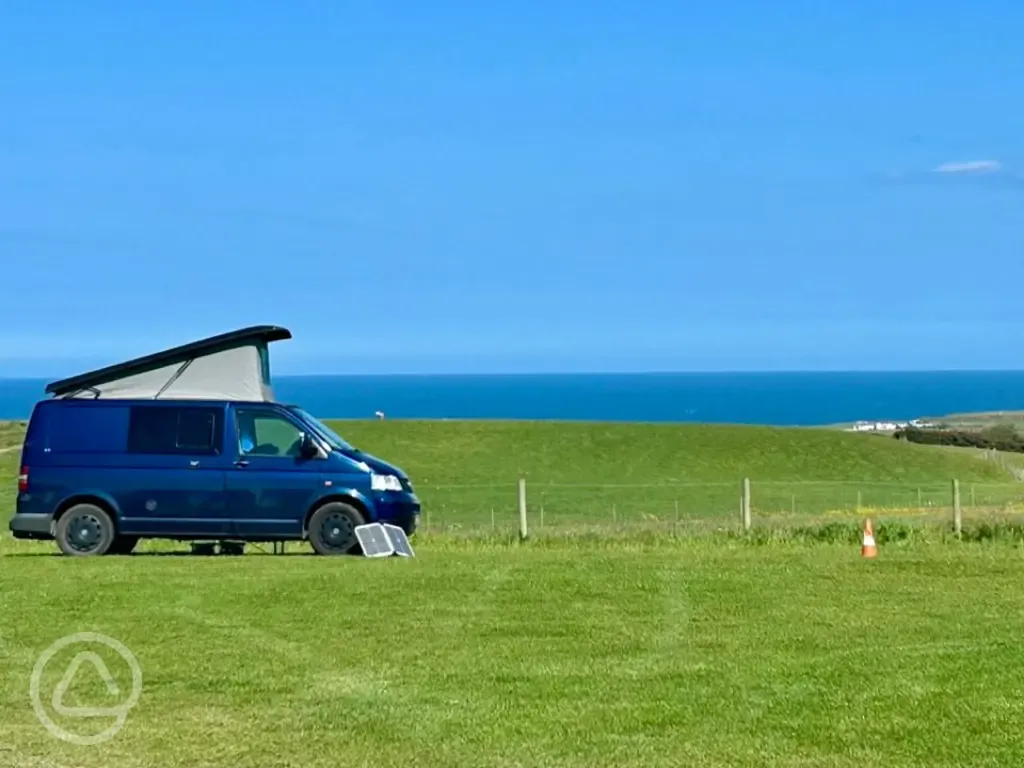 Non electric grass pitches with sea views at Wold Farm Caravan and Camping Site
