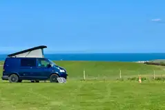 Non electric grass pitches with sea views at Wold Farm Caravan and Camping Site