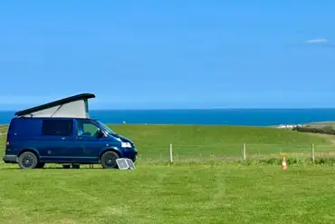 Non electric grass pitches with sea views at Wold Farm Caravan and Camping Site