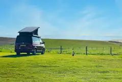 Non electric grass pitches with sea views at Wold Farm Caravan and Camping Site