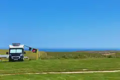 Non electric grass pitches with sea views at Wold Farm Caravan and Camping Site