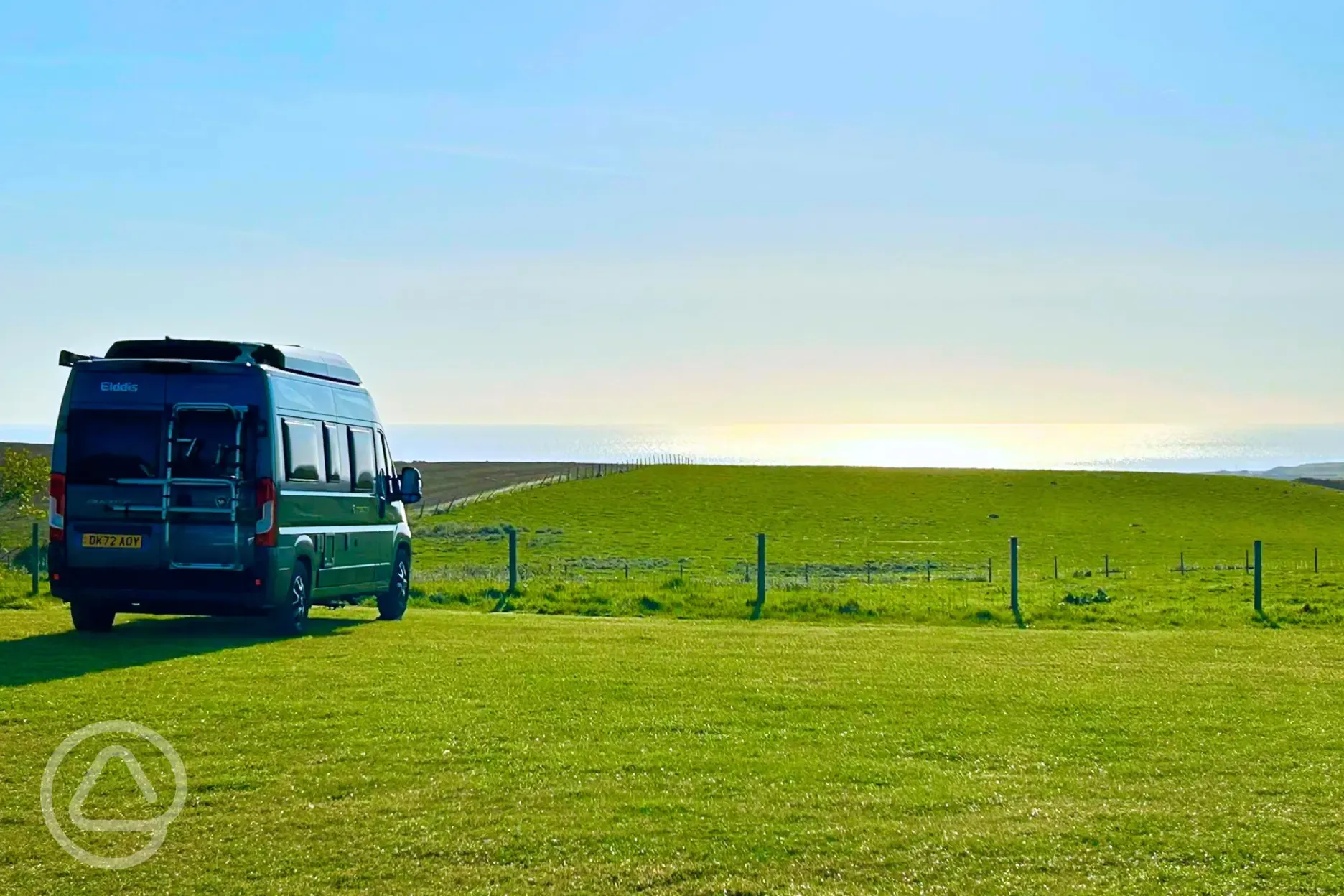 Non electric grass pitches with sea views at Wold Farm Caravan and Camping Site