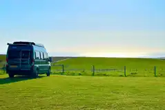 Non electric grass pitches with sea views at Wold Farm Caravan and Camping Site