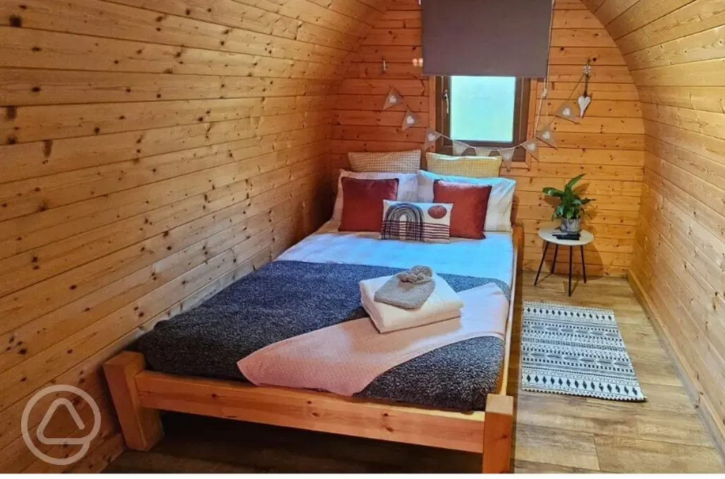 Camping pod double bed and interior