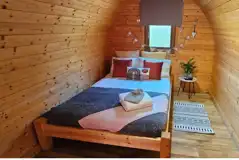 Camping pod double bed and interior