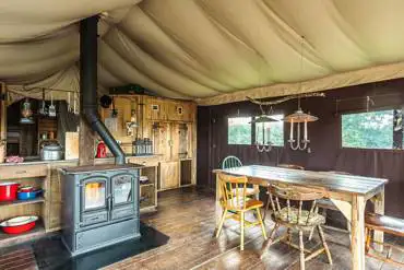 Safari tent wood burner and furniture 