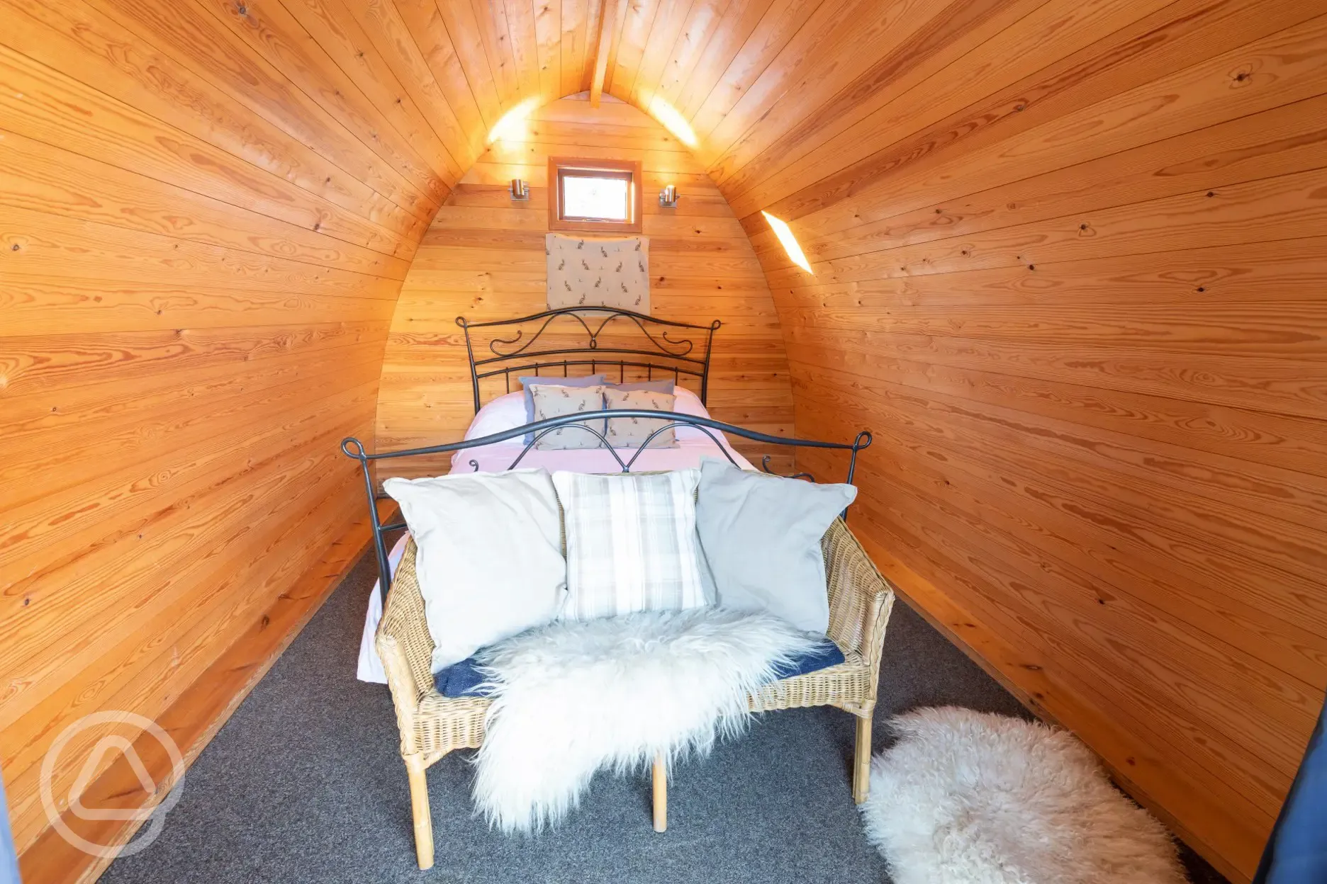 Cosy wooden camping pod interior