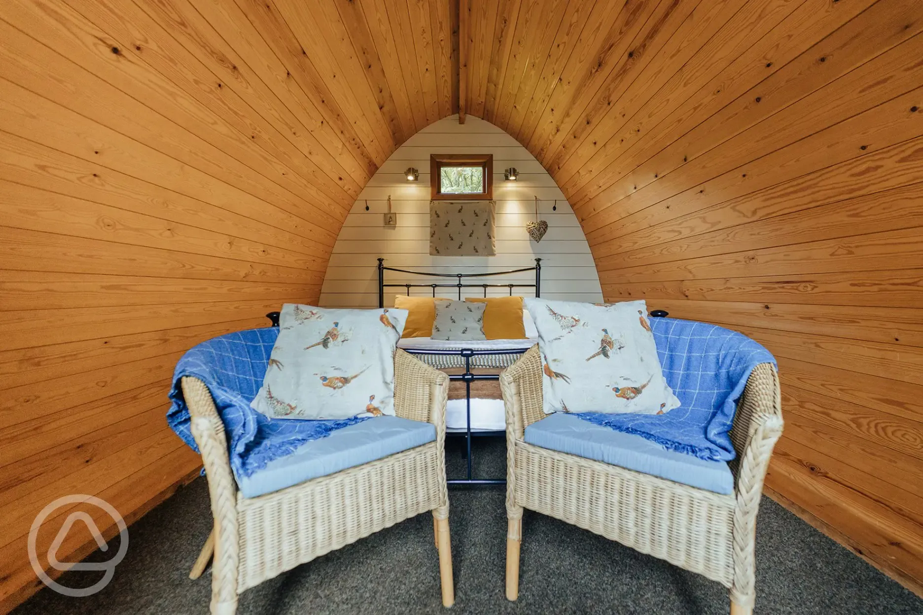 Cosy wooden camping pod interior