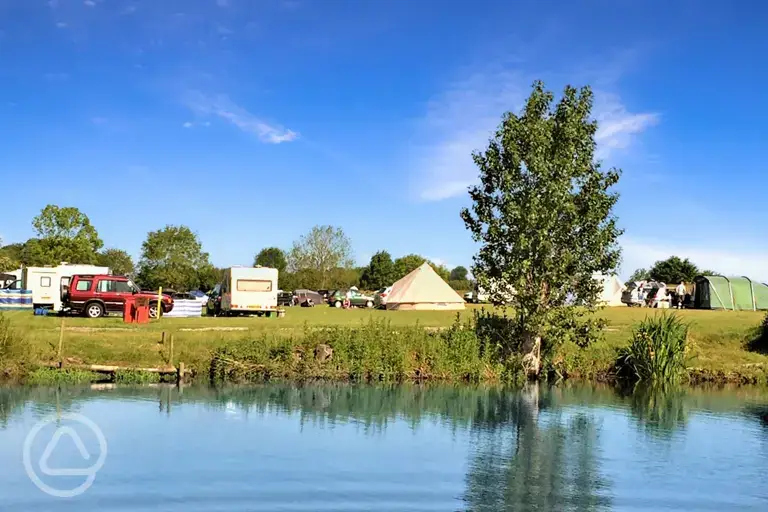 Grass pitches by the lake