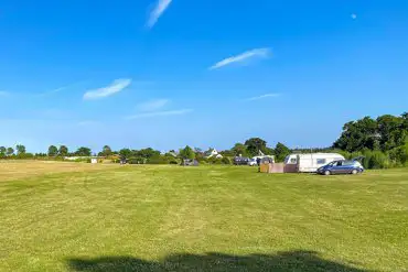 Caravans and motorhomes on grass pitches with awning space