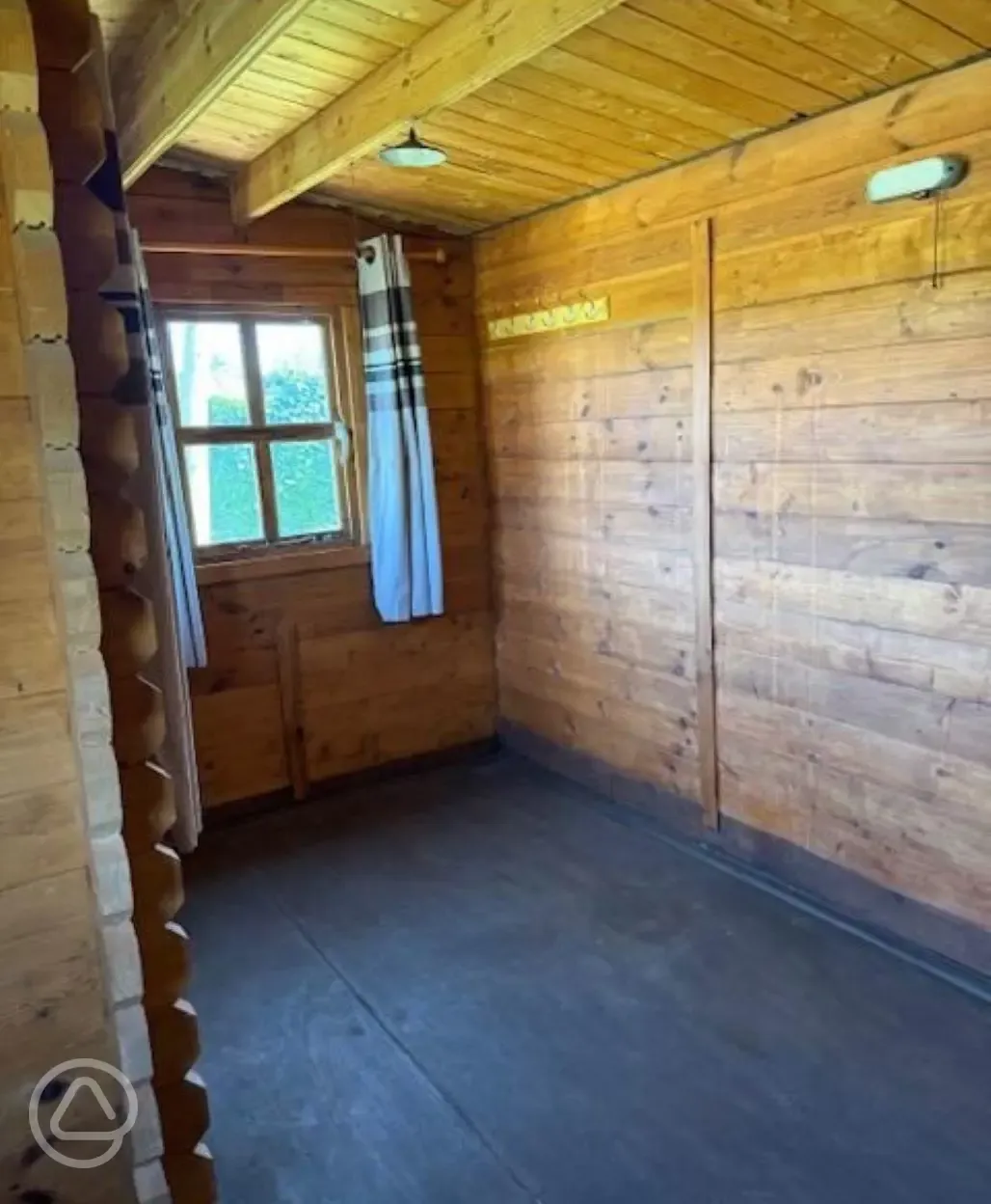 Unfurnished log cabin interior, able to sleep four with solar lighting Unfurnished log cabin interior, able to sleep four with solar lighting