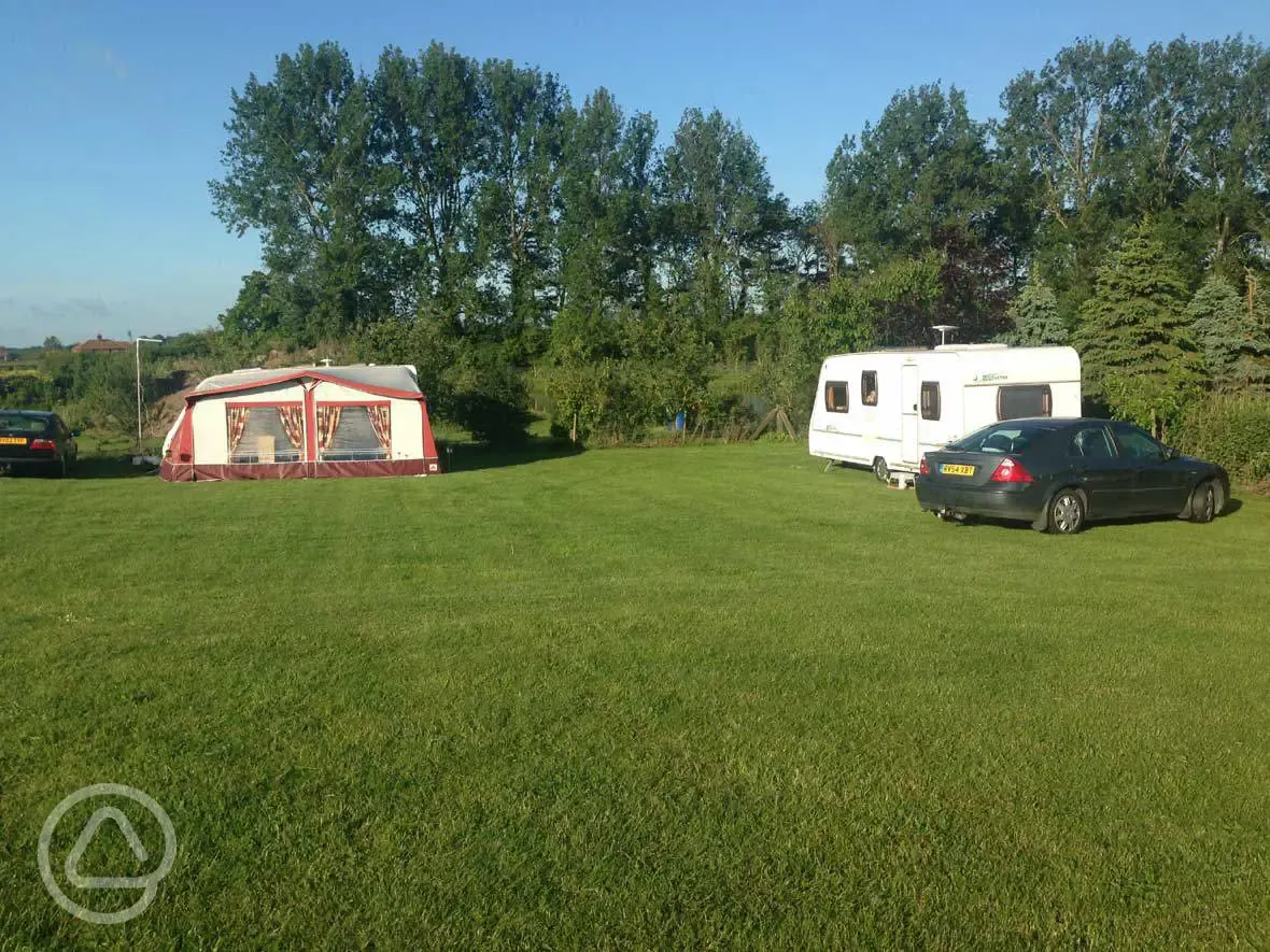 Caravans on grass pitches with awning and parking space Caravans on grass pitches with awning and parking space