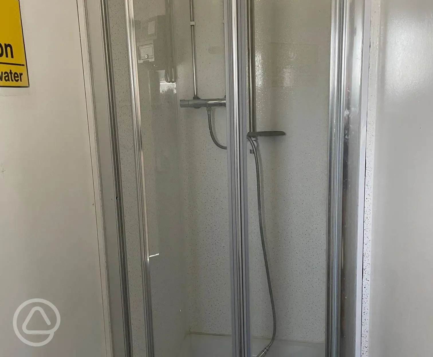 Shower cubicles with hooks and benches for £1 per five minutes (hot water) Shower cubicles with hooks and benches for £1 per five minutes (hot water)