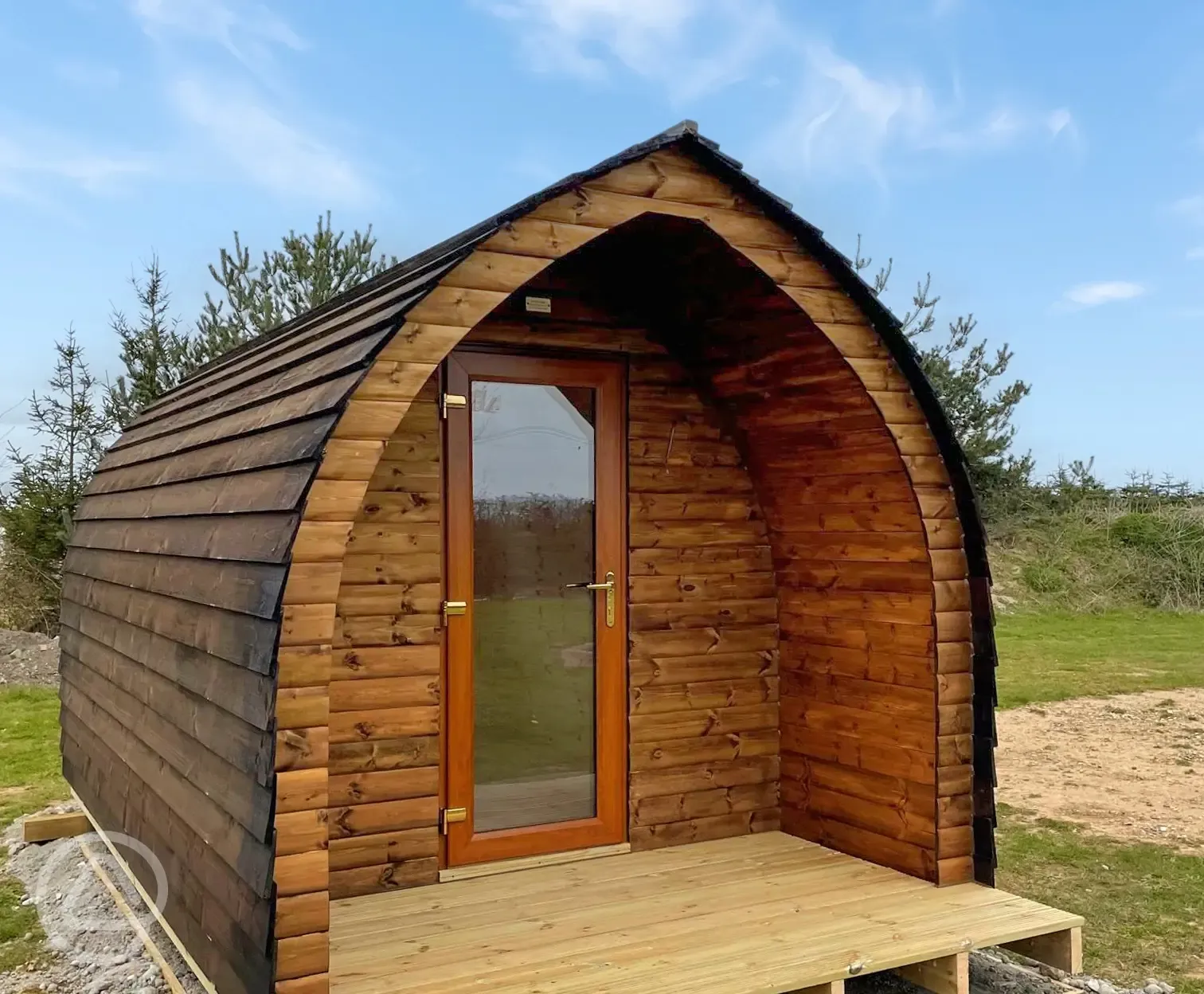 Camping pod exterior with private fire pit and picnic bench Camping pod exterior with private fire pit and picnic bench