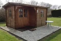 Unfurnished log cabin with outdoor furniture