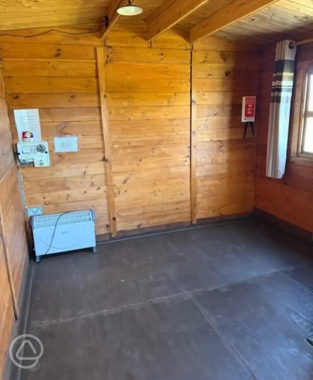 Unfurnished log cabin interior, able to sleep four with solar lighting Unfurnished log cabin interior, able to sleep four with solar lighting