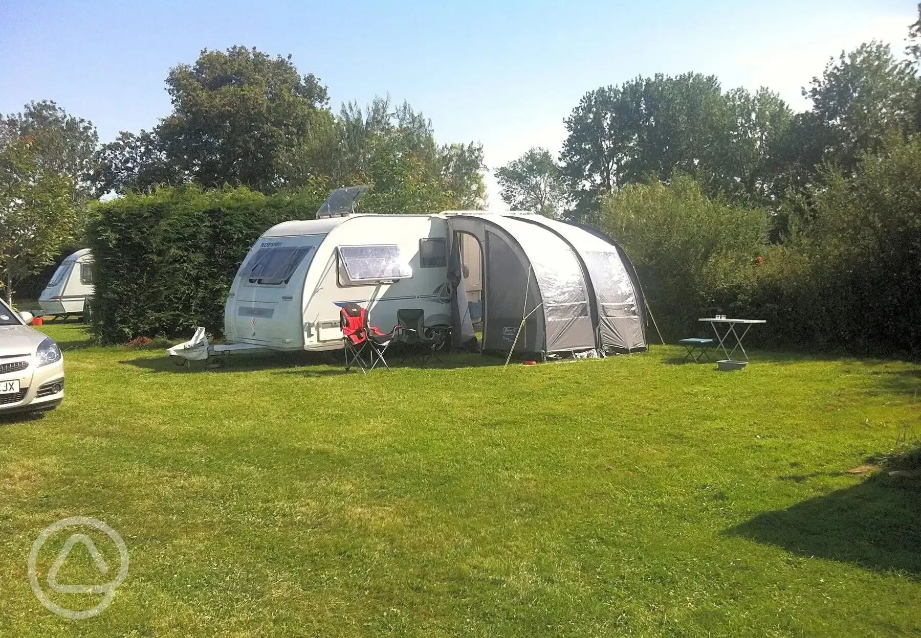 Caravans on grass pitches with awning and parking space Caravans on grass pitches with awning and parking space