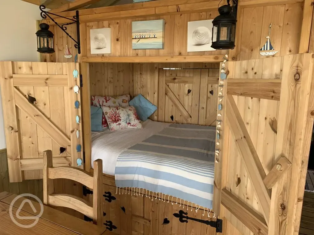 Cosy cupboard bed in Beach Cabin