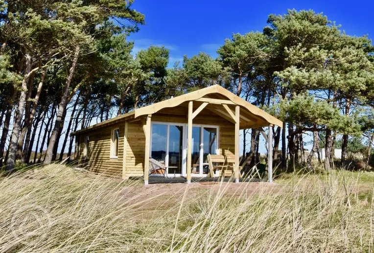 Beach cabin next to Tyninghame Beach on a wide grassy field