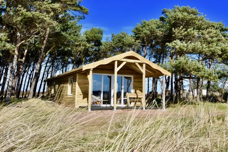 Beach cabin next to Tyninghame Beach on a wide grassy field
