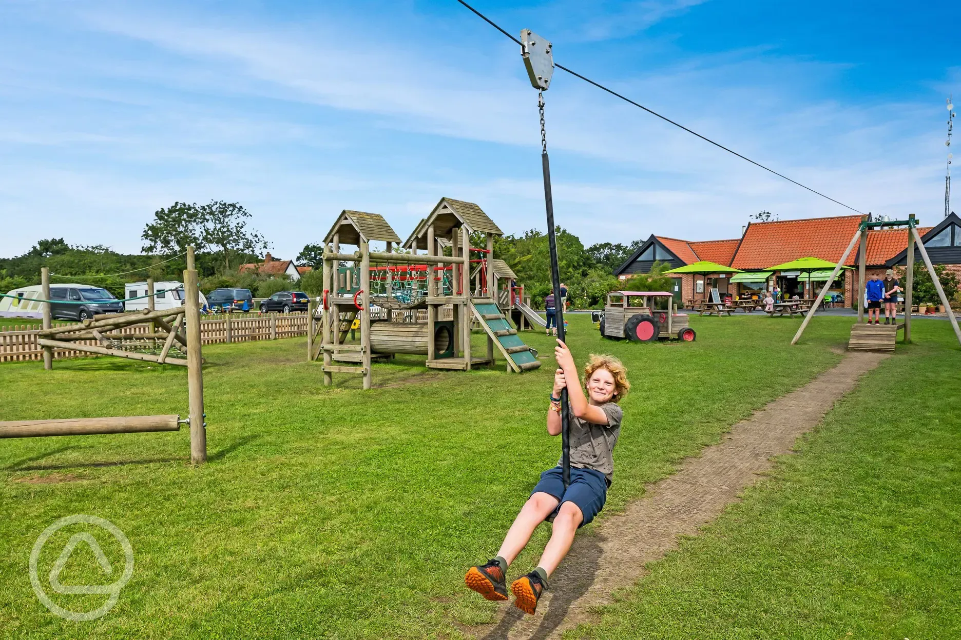 Children's play area at Haw Wood Farm with a zip wire and climbing frames
