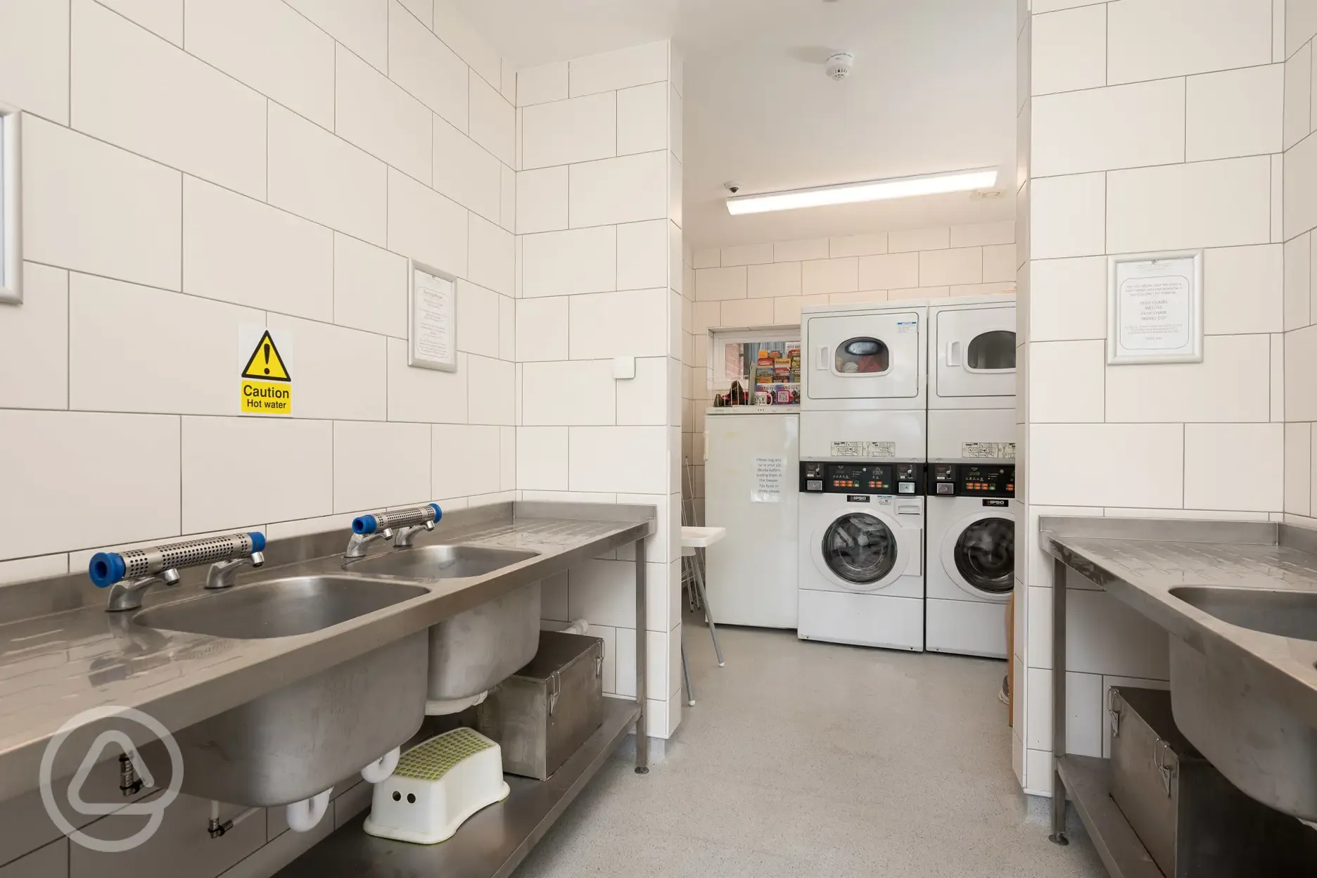 Washing up and laundry area with washing machines and tumble dryers