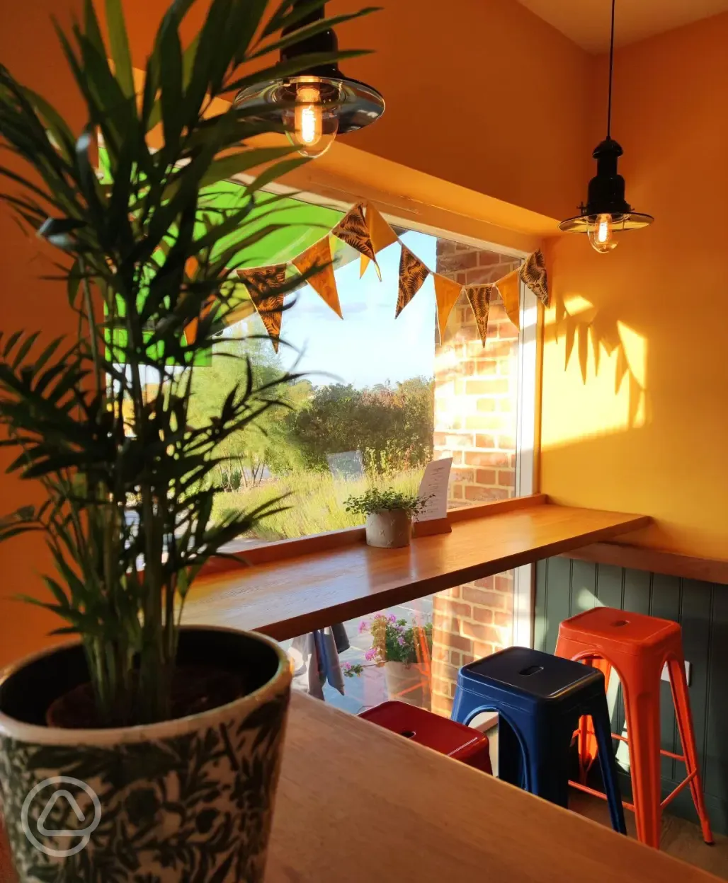 Haw Wood Farm's café and shop with indoor seating by the window