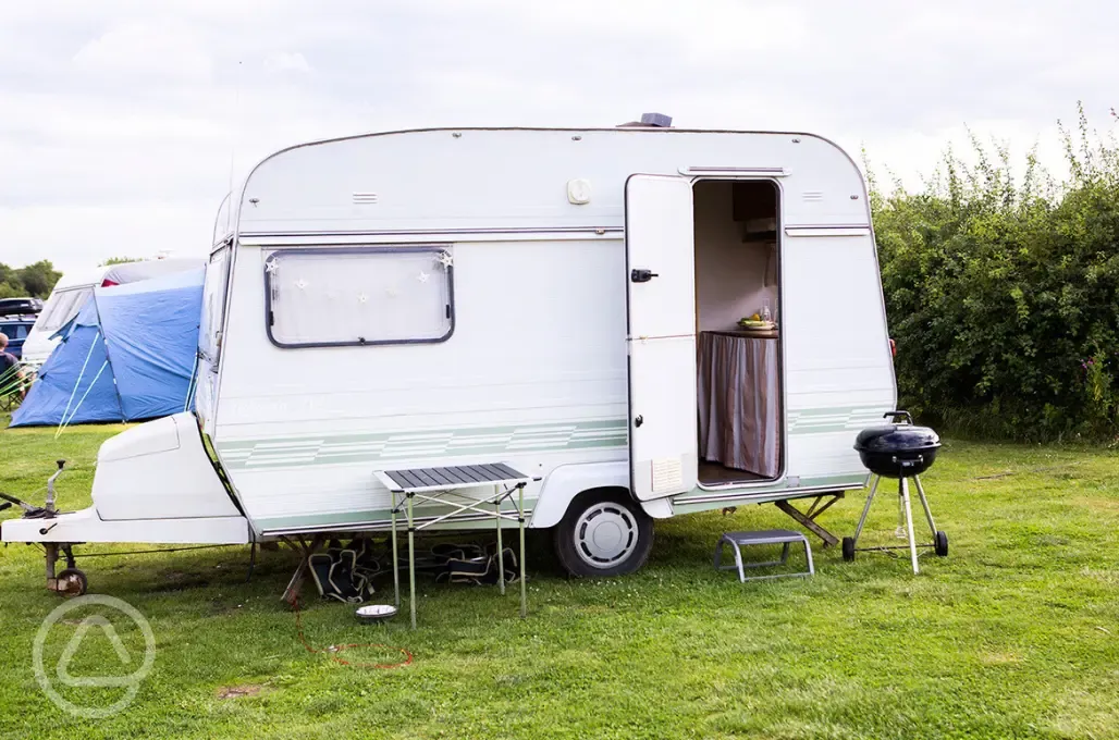 Caravan on grass pitches at Haw Wood Farm