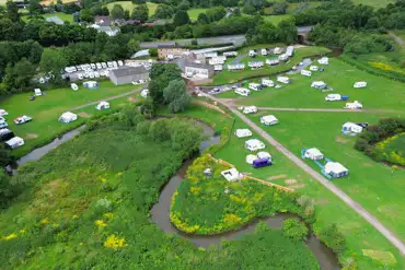 Aerial of Mill House Caravan Site and Boatyard with the River Salwarpe