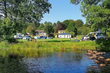 Riverside grass pitches at Riverside Chalet and Caravan Park