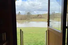 View of the fishing lake from the log pod