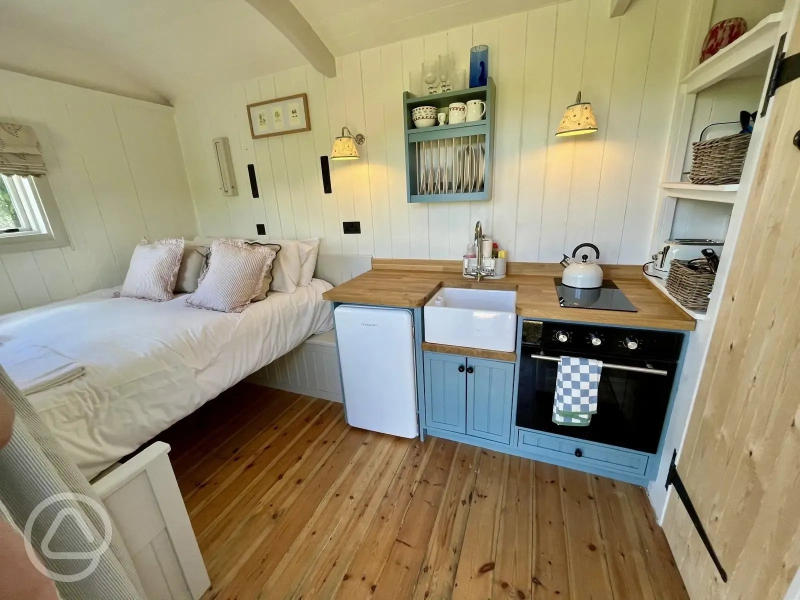 The Hector hut kitchen and bed