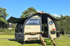 Landpod with sides that raise up